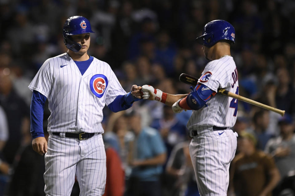 Chicago Cubs' Joc Pederson left, celebrates with teammate Willson Contreras right, at home plate after scoring on a Javier Baez RBI ground rule double during the sixth inning of a baseball game against the Cleveland Indians Tuesday, June 22, 2021, in Chicago. Chicago won 7-1. (AP Photo/Paul Beaty)