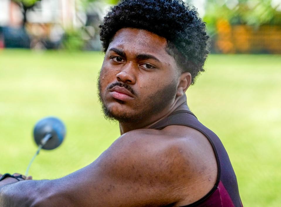 Tarik Robinson-O'Hagan throws the hammer for Woonsocket during a meet in June.