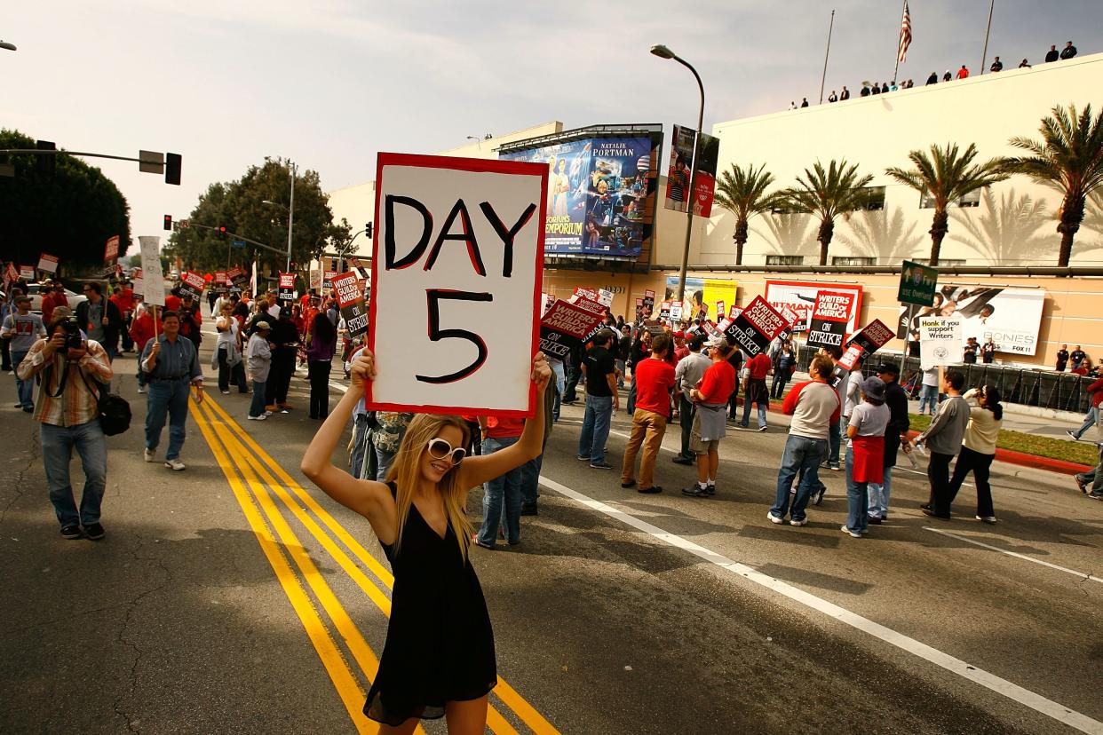 CENTURY CITY, CA - NOVEMBER 09:  More than 3,000 movie and television writers and their supporters rally outside Fox Studios on the fifth day of their strike against the producers and studios that use them on November 9, 2007 in Century City, California. Television shows are increasingly being force to show re-runs as 12,000-member Writers Guild of America (WGA) strike for a greater share of new media revenue.   (Photo by David McNew/Getty Images)