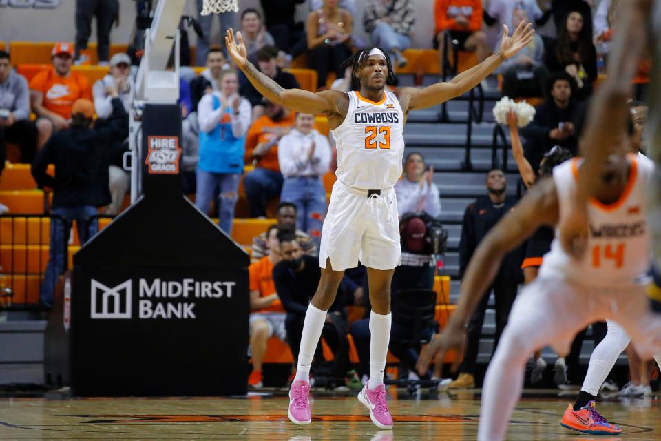 Oklahoma State Cowboys forward Tyreek Smith (23) celebrates during an NCAA college men's basketball game between the West Virginia Mountaineers and the Oklahoma State University Cowboys (OSU) at Gallagher-Iba Arena in Stillwater, Saturday, Feb. 12, 2022. Oklahoma State won 81-58. 