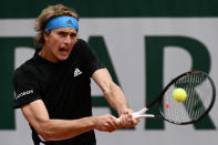 Germany's Alexander Zverev returns the ball to Australia's John Millman during their men's singles first round match on day three of The Roland Garros 2019 French Open tennis tournament in Paris on May 28, 2019. (Photo by Philippe Lopez/AFP/Getty Images)