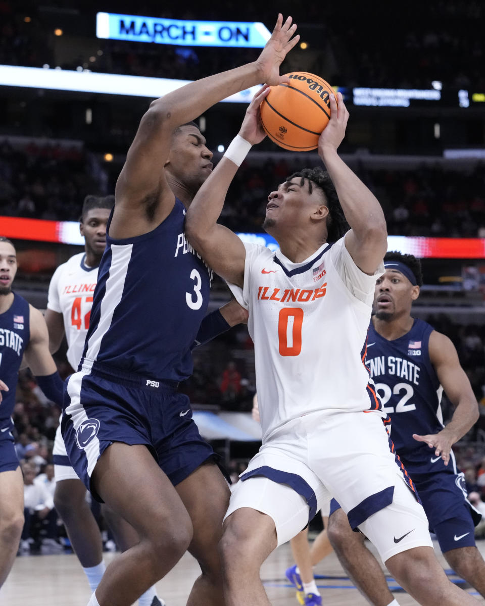 Illinois's Terrence Shannon Jr. (0) drives to the basket as Penn State's Kebba Njie defends during the second half of an NCAA college basketball game against Penn State at the Big Ten men's tournament, Thursday, March 9, 2023, in Chicago. Penn State won 79-76. (AP Photo/Charles Rex Arbogast)