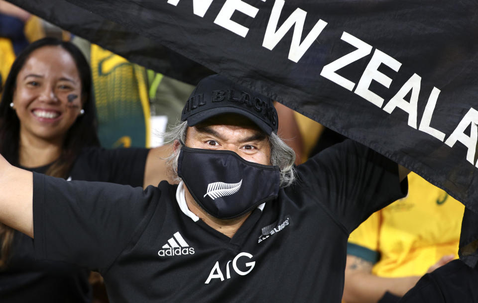 An All Blacks fan gestures during the Bledisloe rugby test between Australia and New Zealand at Suncorp Stadium, Brisbane, Australia, Saturday, Nov.7, 2020. (AP Photo/Tertius Pickard)