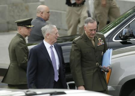 U.S. Defense Secretary James Mattis (C) and Joint Chiefs Chairman General Joseph Dunford (R) depart after briefing members of the U.S. Senate on North Korea at the White House in Washington, U.S, April 26, 2017. REUTERS/Kevin Lamarque