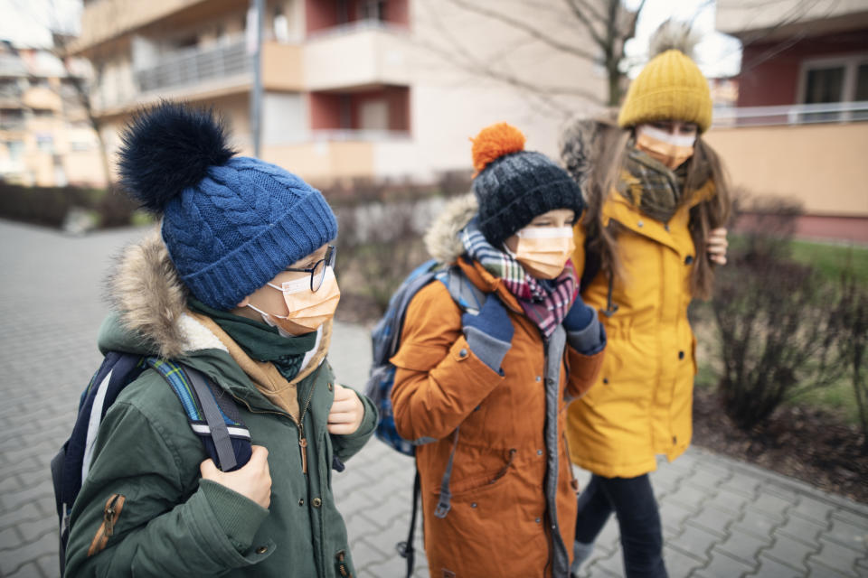 Three kids wearing anti virus masks. Kids are going to school.   Shot with BMPCC4k with Q0 Raw