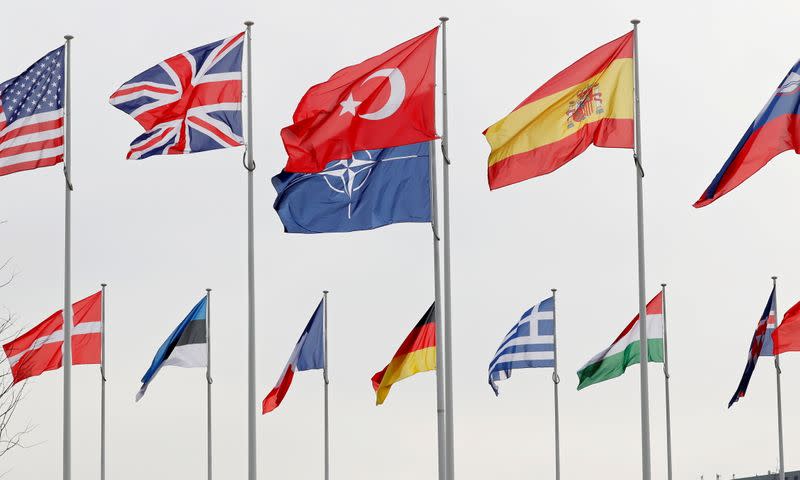 FILE PHOTO: Flags of NATO member countries flutter at the Alliance headquarters in Brussels