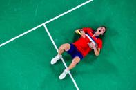 <p>Viktor Axelsen of Denmark falls to the ground after winning the men's singles gold medal badminton match between Chen Long of China and Viktor Axelsen of Denmark on August 2.</p>