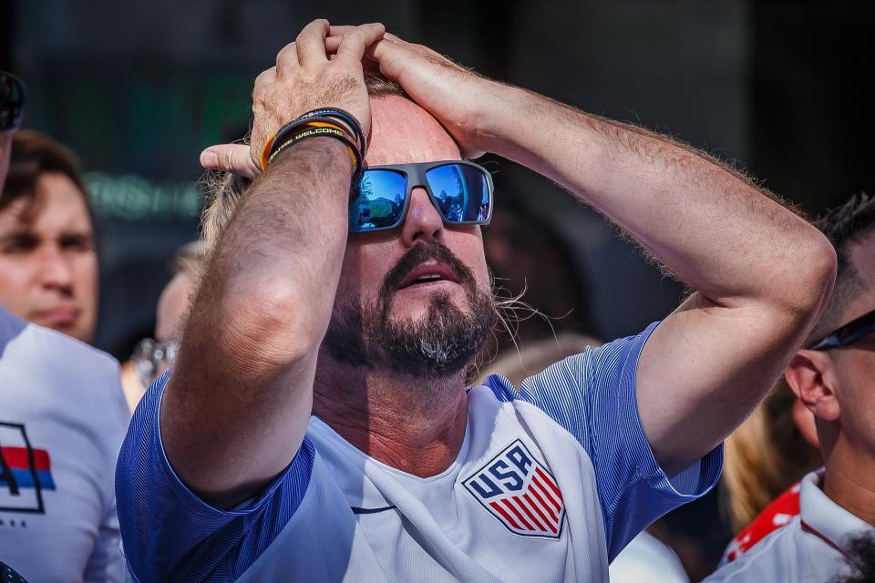 United States Men's National Team supporters watch the FIFA World Cup 2022 match against the Netherlands outside of O'Shea's Irish Pub in downtown West Palm Beach, Fla., on December 3, 2022. The US lost to the Netherlands 3-1.