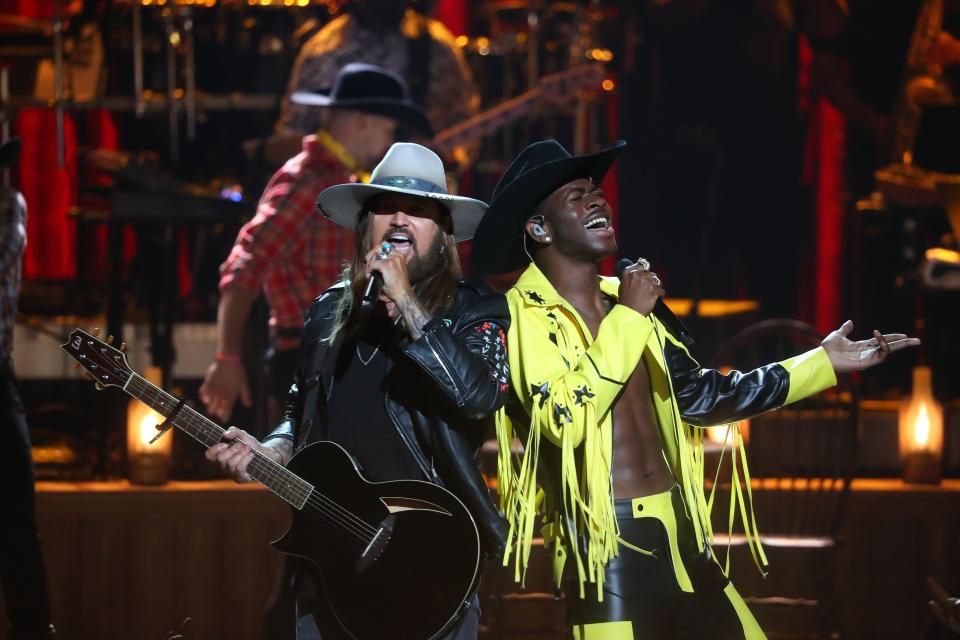 Billy Ray Cyrus (L) and Lil Nas X perform onstage during the 2019 BET awards at Microsoft Theater in Los Angeles, California on June 23, 2019. (Photo by Jean-Baptiste LACROIX / AFP)JEAN-BAPTISTE LACROIX/AFP/Getty Images ORIG FILE ID: AFP_1HS427