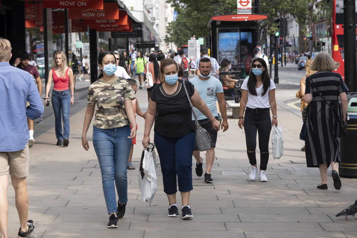 As Britain enters a period of deep recession, with some shops closing either temporarily or permanently as the economic downturn caused by the Covid-19 pandemic cuts hard, shoppers wearing face masks continue to come to the West End to Oxford Street on 13th August 2020 in London, United Kingdom. The Office for National Statistics / ONS has announced that gross domestic product / GDP, the widest gauge of economic health, fell by 20.4% in the second quarter of the year, compared with the previous quarter. This is the biggest decline since records began. The result is that Britain has officially entered recession, as the UK economy shrank more than any other major economy during the coronavirus outbreak. (photo by Mike Kemp/In PIctures via Getty Images)