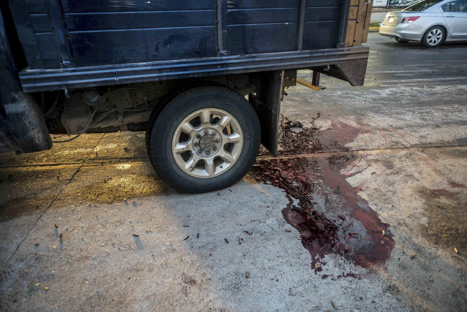 Blood stains the street after a gunfight in Culiacan, Mexico, Thursday, Oct. 17, 2019. An intense gunfight with heavy weapons and burning vehicles blocking roads raged in the capital of Mexico’s Sinaloa state Thursday after security forces located one of Joaquín “El Chapo” Guzmán’s sons who is wanted in the U.S. on drug trafficking charges. (AP Photo/Augusto Zurita)