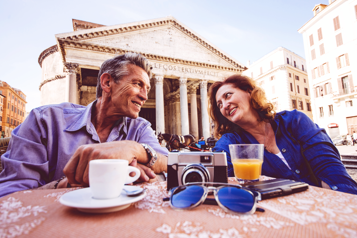 Relaxed couple sitting at an Italian cafe in Rome