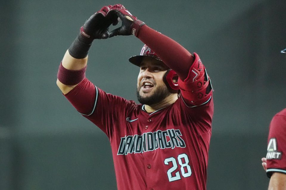 Arizona Diamondbacks' Eugenio Suárez smiles as he celebrates his two-run single against the Toronto Blue Jays during the fifth inning of a baseball game, Sunday, July 14, 2024, in Phoenix. (AP Photo/Ross D. Franklin)