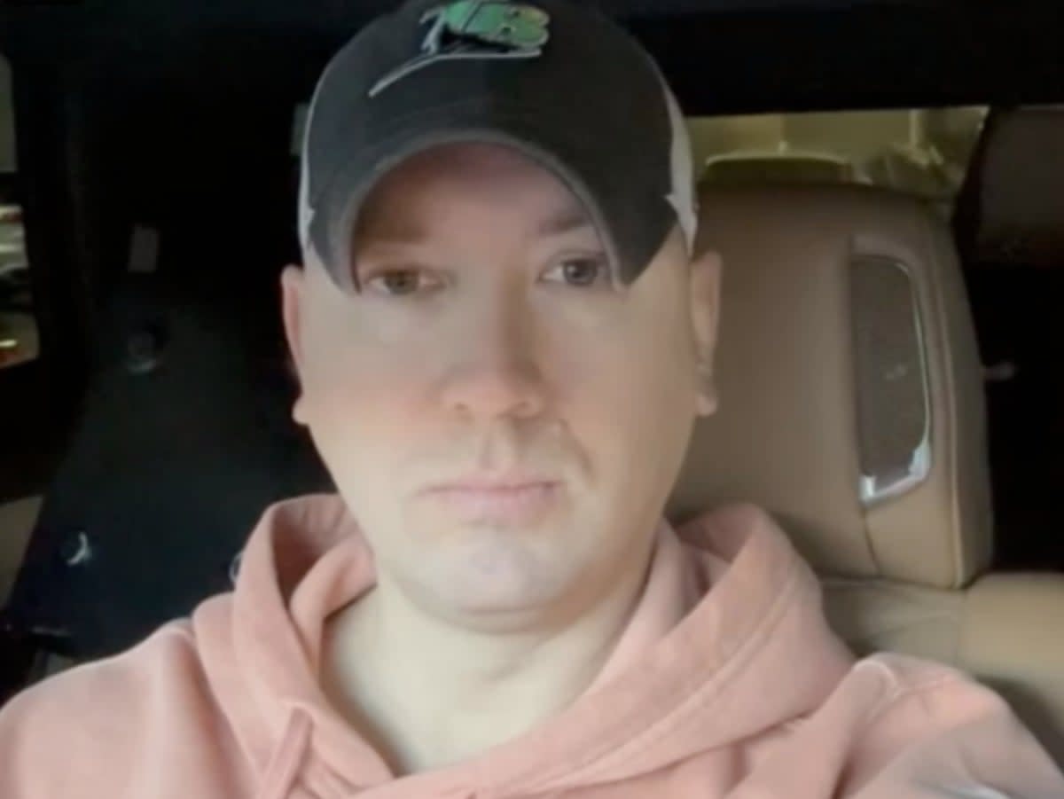 Phil Godlewski, a leader in the QAnon conspiracy movement, doing a livestream from his car. Mr Godlewski pleaded guilty to corrupting a minor after allegedly having an inappropriate relationship with a 15-year-old girl (screengrab/Rumble)