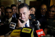 President of Paraguay’s congress Roberto Acevedo speaks to the press as lawmakers argued over a possible change in law that would allow President Horacio Cartes to run for re-election, in Asuncion, Paraguay March 28, 2017. REUTERS/Jorge Adorno