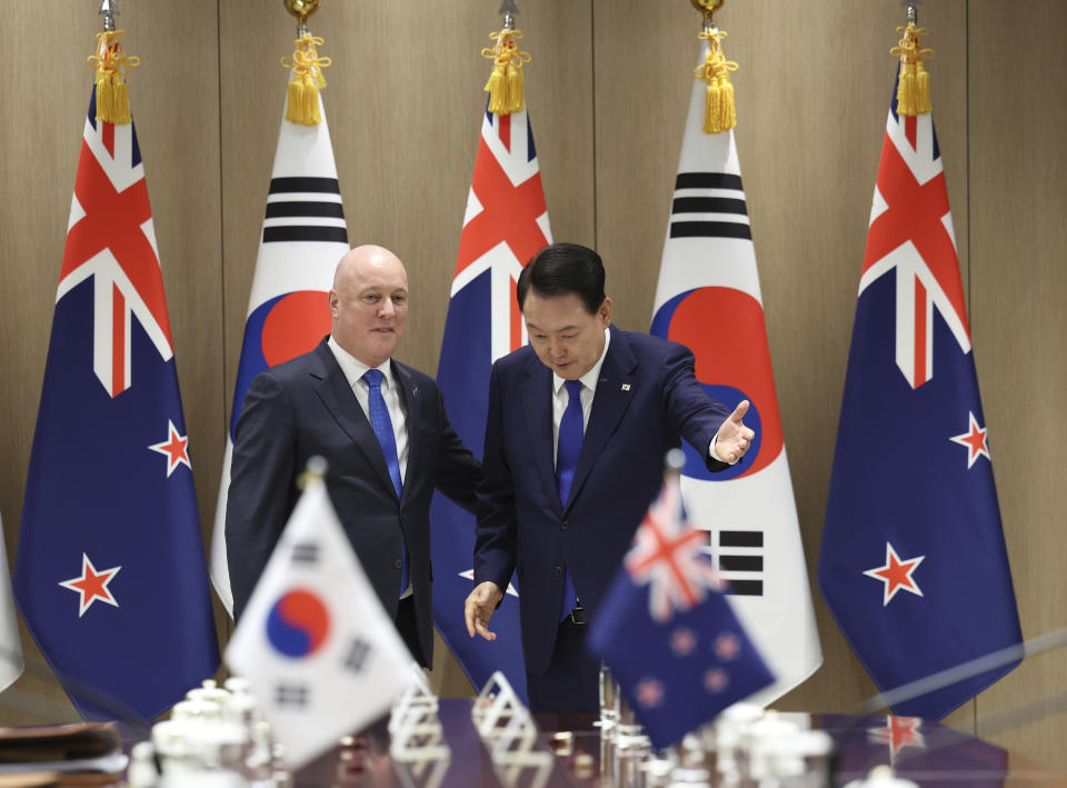 South Korean President Yoon Suk Yeol, right, greets New Zealand's Prime Minister Christopher Luxon during a meeting at the Presidential Office in Seoul, South Korea, Wednesday, Sept. 4, 2024. (Jin Sung-chul/Yonhap via AP)