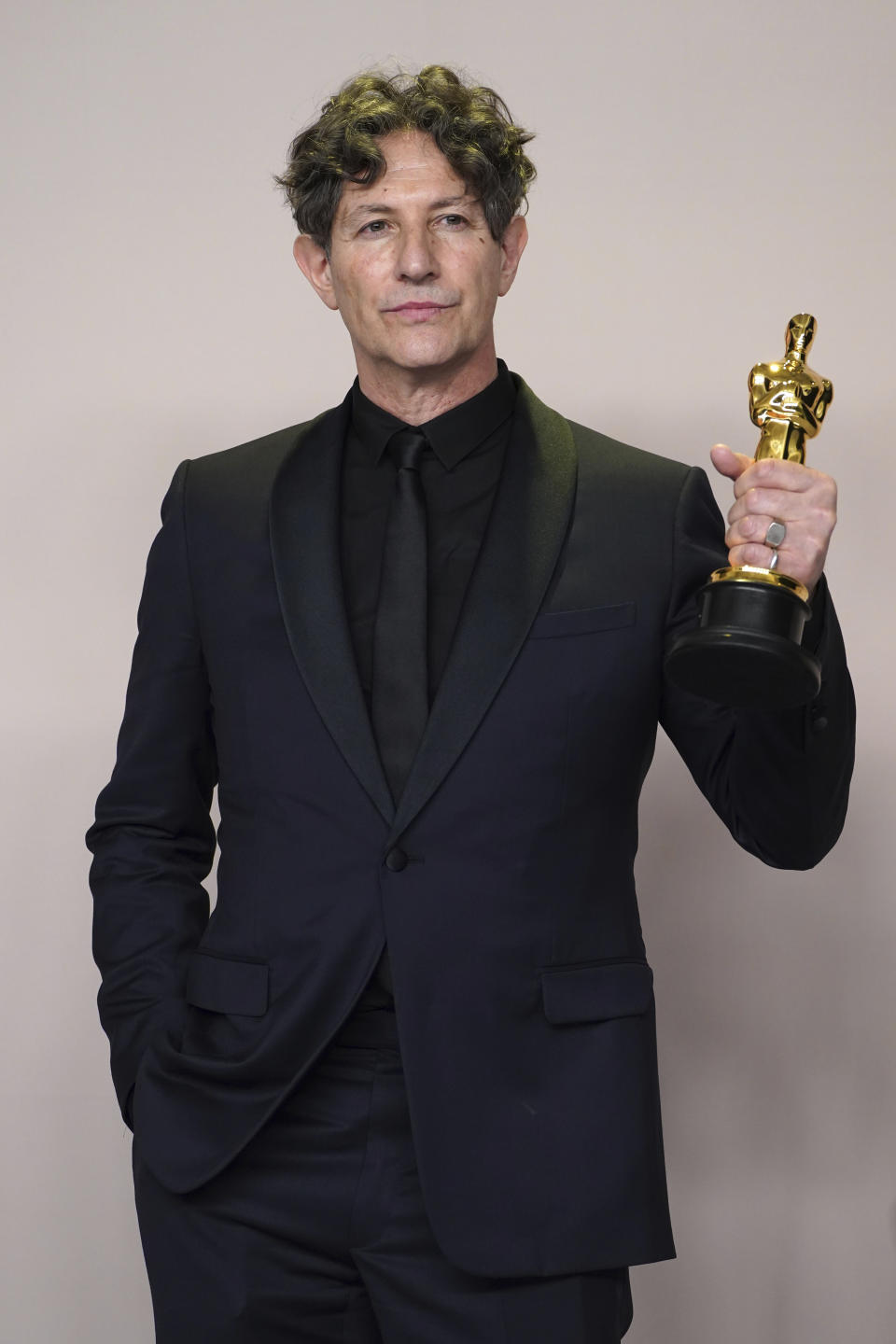 Jonathan Glazer poses with the award for "The Zone of Interest" from the United Kingdom, for best international feature film in the press room at the Oscars on Sunday, March 10, 2024, at the Dolby Theatre in Los Angeles. (Photo by Jordan Strauss/Invision/AP)