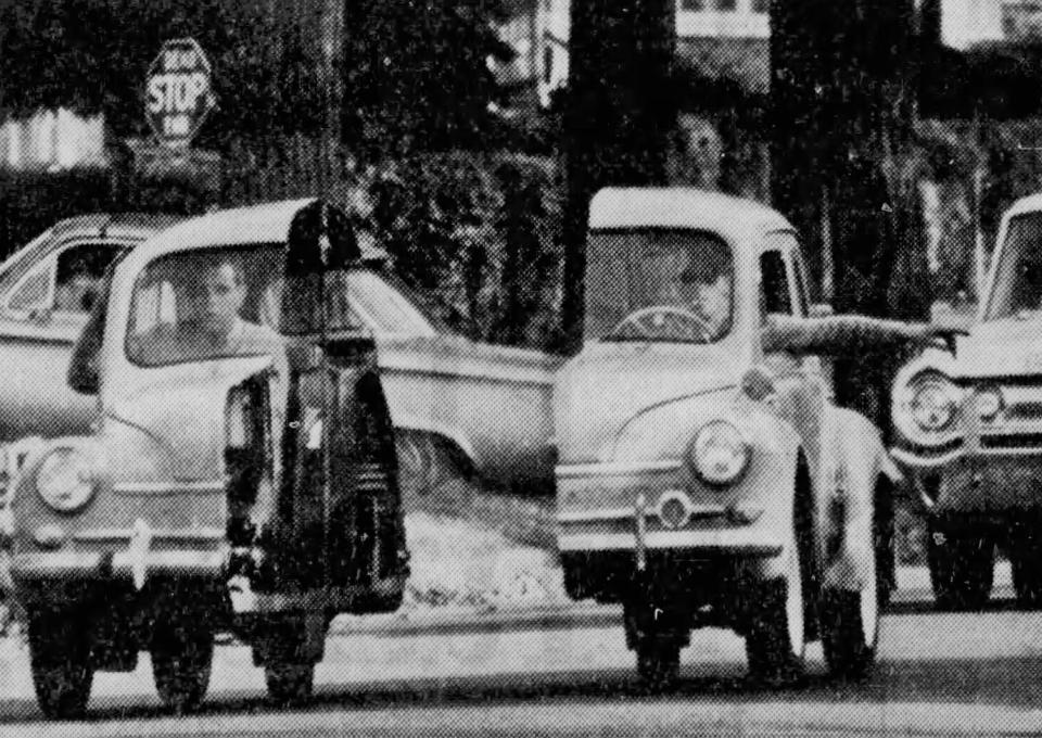A 1959 Renault splits in two as a taxi follows with "Candid Camera" producer Bob Swartz as a passenger in October 1965.