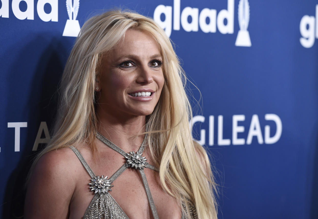 FILE - Britney Spears arrives at the 29th annual GLAAD Media Awards on April 12, 2018, in Beverly Hills, Calif. Spears has asked to address the court to talk about the conservatorship that controls her life and finances. A Los Angeles judge on Tuesday, April 27, 2021, set a June hearing to hear from Spears. (Photo by Chris Pizzello/Invision/AP, File)