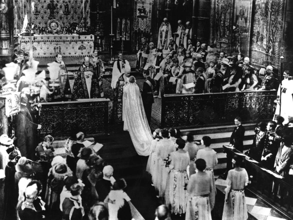 The Queen Mother walks down the aisle at Westminster Abbey to marry King George VI on April 26, 1923.