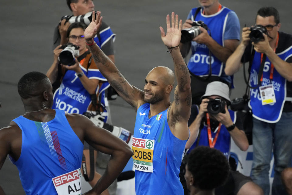 FILE - Lamont Marcell Jacobs, of Italy, celebrates after winning the gold medal in the men's 100 meters final at the the European Athletics Championships in Rome, Saturday, June 8, 2024. At the last two Olympics – one summer, one winter – there were no crowds because of the COVID pandemic. In Paris this summer, once again, all those fans, family members and the burst of energy they bring to all the fun and games will be back. (AP Photo/Gregorio Borgia, File)