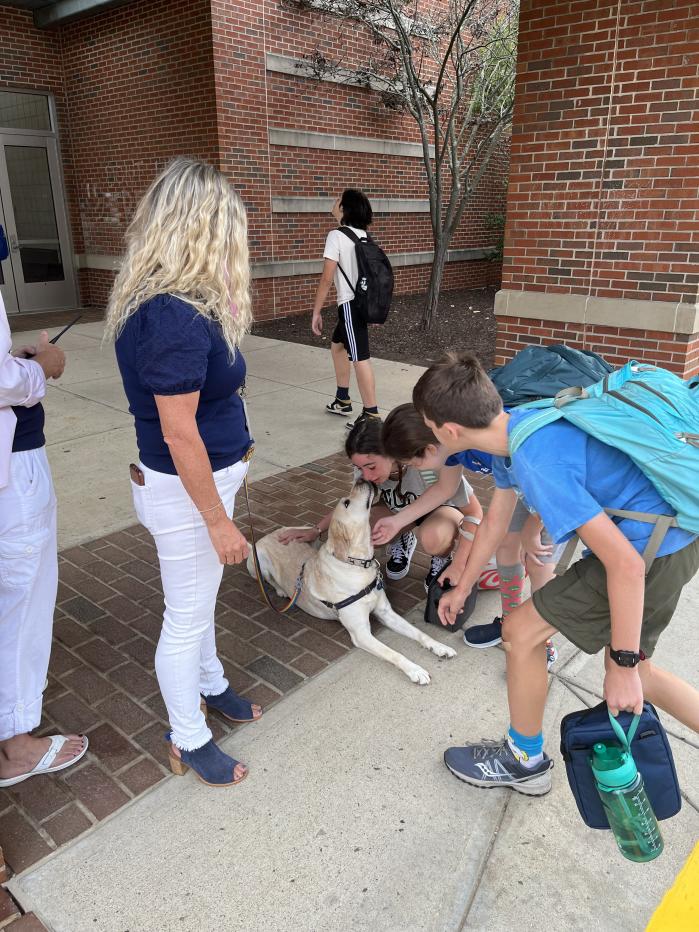 Each morning, students are greeted by the pups as they enter the school building. (Photo: Scotts Ridge Middle School)