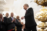 Vladimir Putin walks to take his oath as Russian president during an inauguration ceremony in the Grand Kremlin Palace in Moscow, Russia, Tuesday, May 7, 2024. (AP Photo/Alexander Zemlianichenko, Pool)