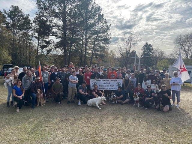 Iron Ruck participants pose for a photo at the Johnny Lawrence Memorial Iron Ruck Thanksgiving Feast