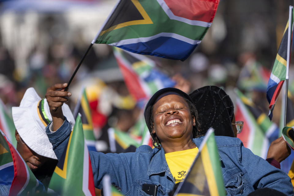 South Africans gather ahead of the inauguration of South Africa's Cyril Ramaphosa as President at the Union Buildings South Lawns in Tshwane, South Africa, Wednesday, June 19, 2024. (AP Photo/Jerome Delay)