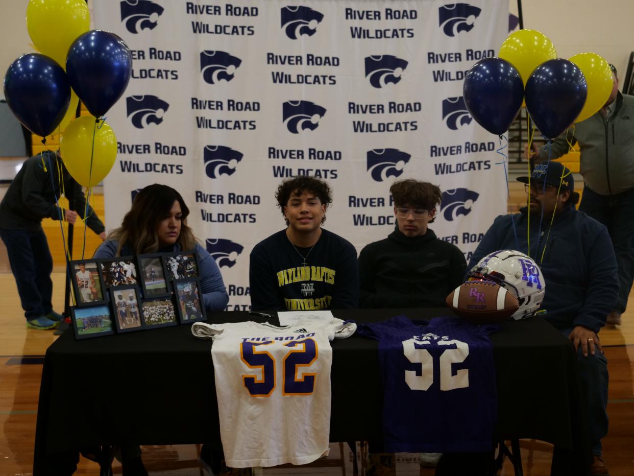 River Road's Jordan Avina (seated second from the left) signed his National Letter of Intent to play football for Wayland Baptist University as part of National Signing Day on Wednesday, February 1, 2023 at River Road High School.