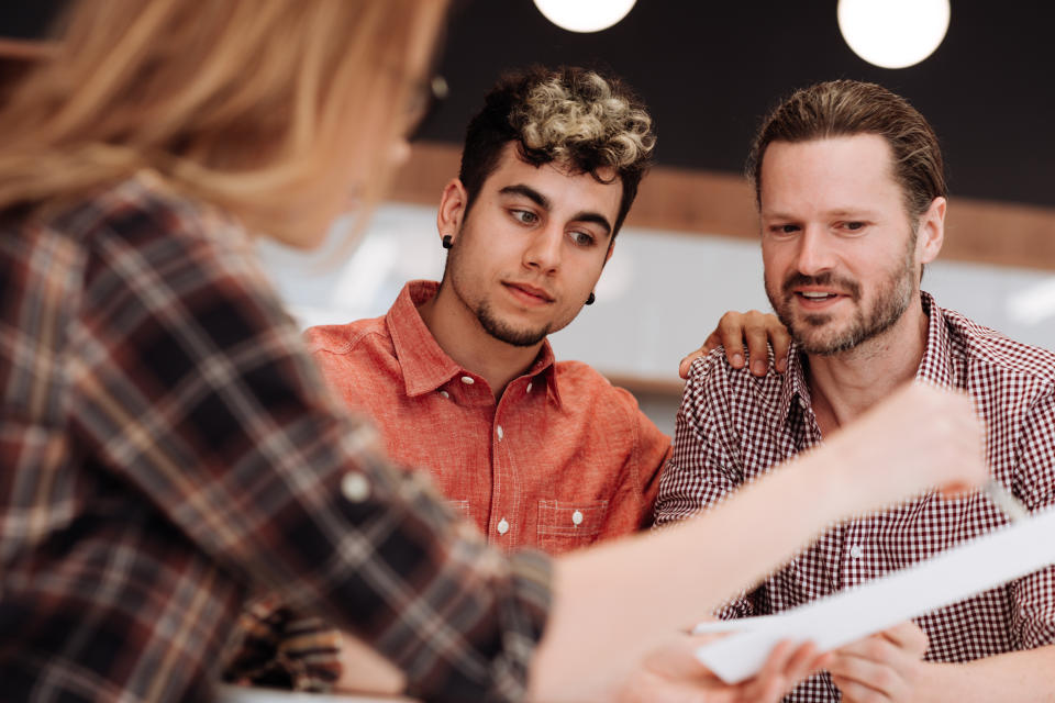 Two men on a meeting with adviser 