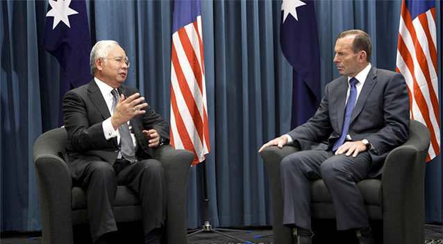 Australian Prime Minister Tony Abbott, right, and Malaysian Prime Minister Najib Razak talk during their meeting at the Commonwealth Parliament Offices in Perth. Photo: AP.