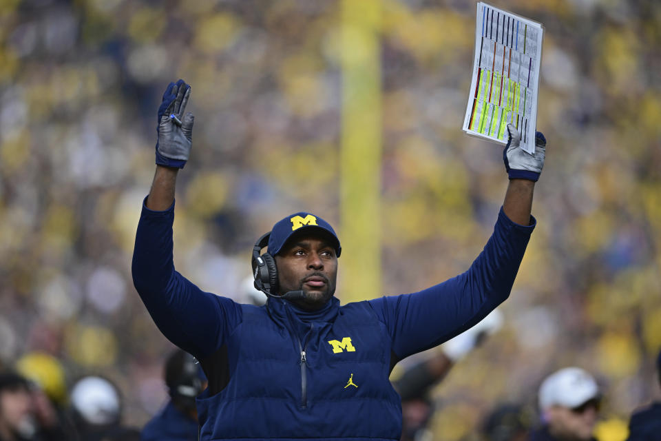 Michigan acting head coach Sherrone Moore reacts to a video replay during the first half of an NCAA college football game against Ohio State, Saturday, Nov. 25, 2023, in Ann Arbor, Mich. (AP Photo/David Dermer)