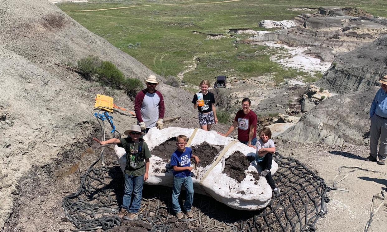 <span>‘It was a dream come true’: Jessin Fisher (bottom left) with his family and the fossil.</span><span>Photograph: Tyler Lyson</span>