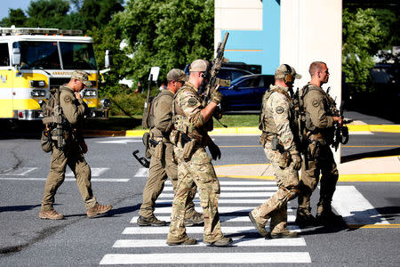 Tactical police gather at shooting scene outside Capital Gazette newspaper in Annapolis, Maryland