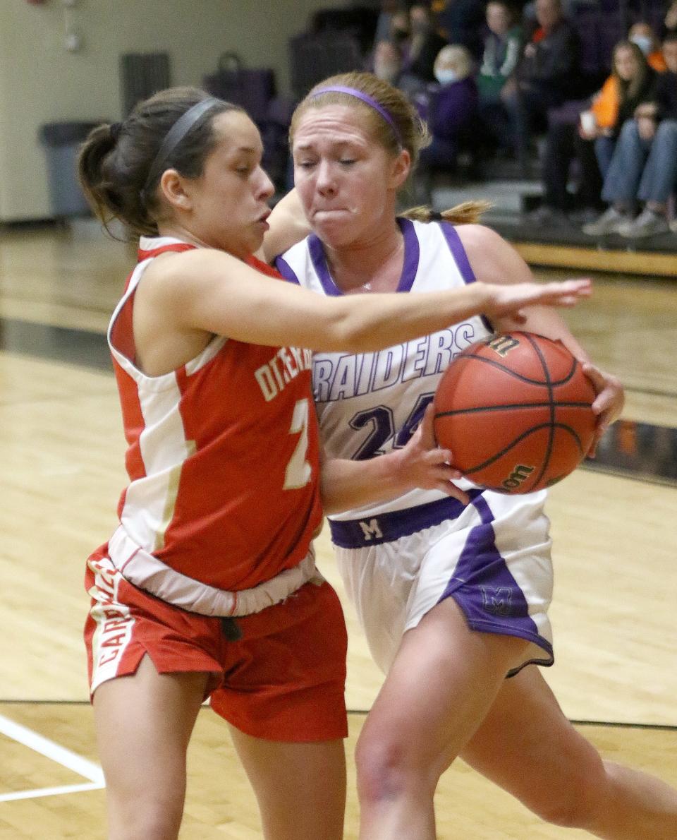 Mount Union's Kelsie Glass, right, scored 14 points to lead the Purple Raiders against John Carroll on Wednesday night.