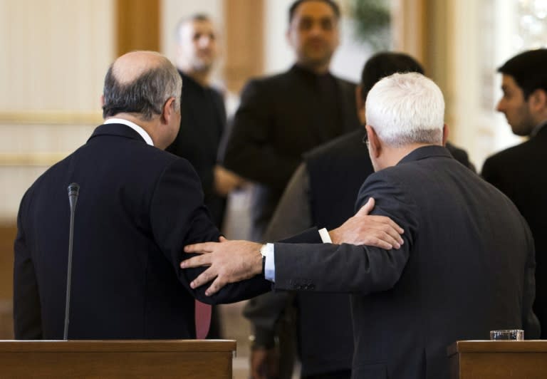 Iranian Foreign Minister Mohammad Javad Zarif (R) and his French counterpart Laurent Fabius leave their press conference following talks in Tehran on July 29, 2015