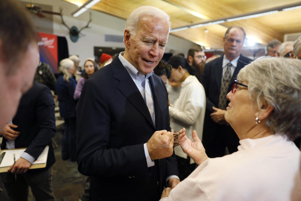 Democratic presidential candidate former Vice President Joe Biden talks with audience members during a bus tour stop at Water's Edge Nature Center, Monday, Dec. 2, 2019, in Algona, Iowa. (AP Photo/Charlie Neibergall)