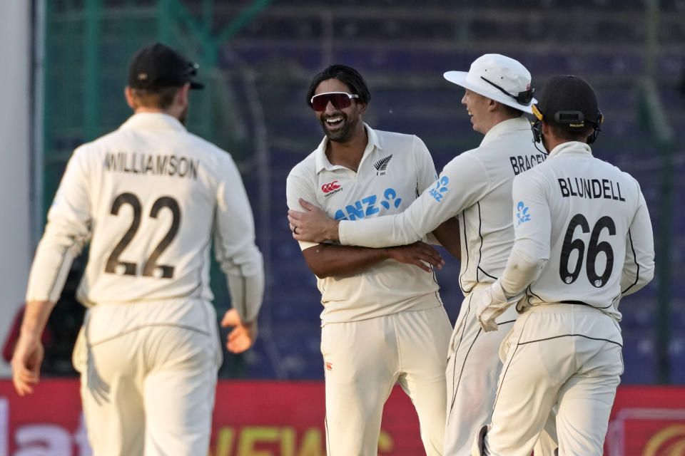 New Zealand's Ish Sodhi, center, celebrates with teammates after the dismissal of Pakistan's Mir Hamza during the third day of the second test cricket match between Pakistan and New Zealand, in Karachi, Pakistan, Wednesday, Jan. 4, 2023. (AP Photo/Fareed Khan)