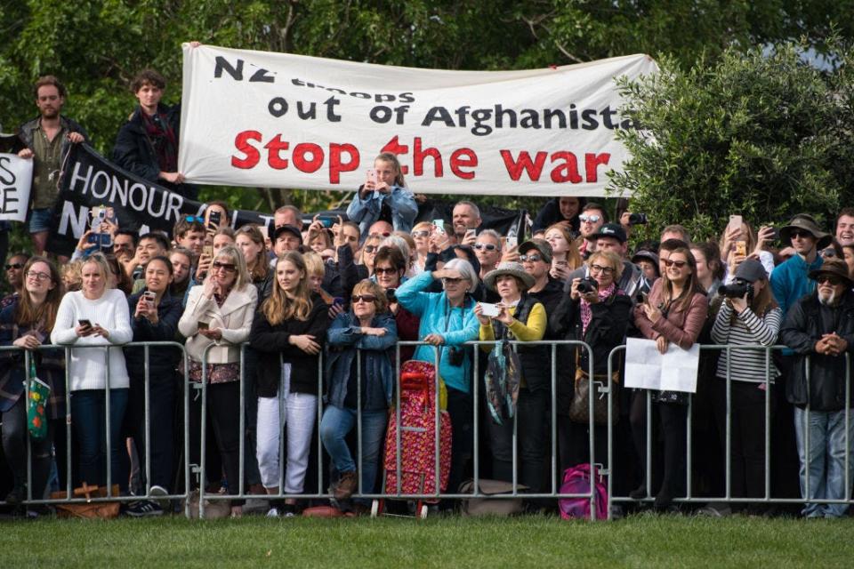 Anti-war protesters gather during Prince Harry and Meghan Markle's tour of New Zealand