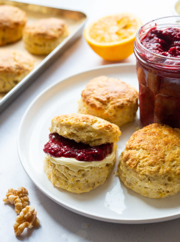 <p>Elizabeth Chloe</p><p>Walnut and orange scones are the perfect afternoon tea cake! The orange zest in this scone recipe adds a delicate citrusy flavour, that is complemented further by the addition of cream and raspberry jam, while the walnuts add a little extra crunch.</p><p><strong>Get the recipe: <a href="https://elizabethchloe.com/easy-walnut-and-orange-scones/" rel="nofollow noopener" target="_blank" data-ylk="slk:Easy Walnut and Orange Scones;elm:context_link;itc:0;sec:content-canvas" class="link rapid-noclick-resp"><em>Easy Walnut and Orange Scones</em></a></strong></p>