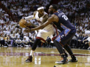 Charlotte Bobcats' Al Jefferson (25) defends Miami Heat's LeBron James during the first half in Game 2 of an opening-round NBA basketball playoff series, Wednesday, April 23, 2014, in Miami. (AP Photo/Lynne Sladky)