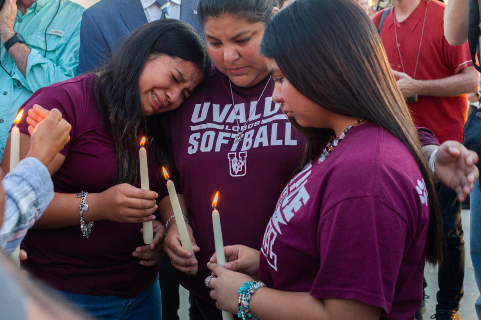 People comfort each other following a vigil held at the Uvalde County Fairplex in Uvalde, Texas, on May 25, 2022. (Liz Moskowitz for NBC News)