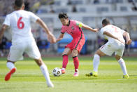 South Korea's Son Heung-min, center, fights for the ball against Lebanon during their Asian zone Group H qualifying soccer match for the FIFA World Cup Qatar 2022 at Goyang stadium in Goyang, South Korea, Sunday, June 13, 2021. (AP Photo/Lee Jin-man)