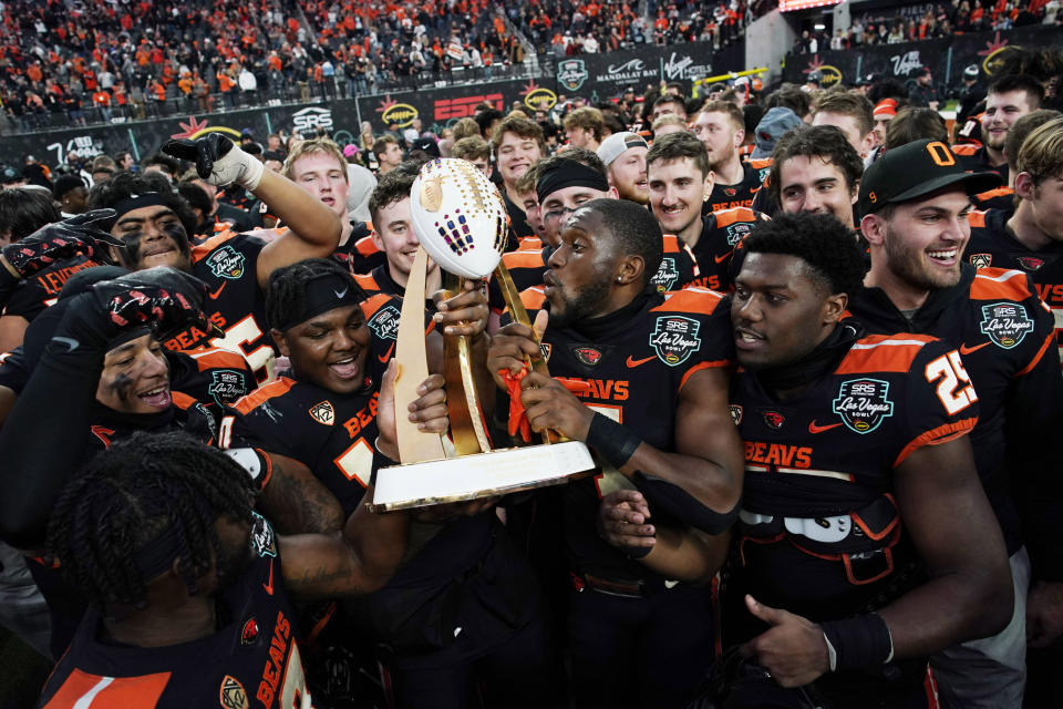 Oregon State players celebrate after defeating Florida in the Las Vegas Bowl NCAA college football game Saturday, Dec. 17, 2022, in Las Vegas. (AP Photo/John Locher)