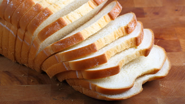 man holding grocery store bread