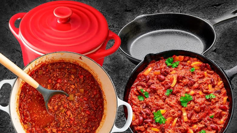 Enamel and traditional cast iron pots with chili