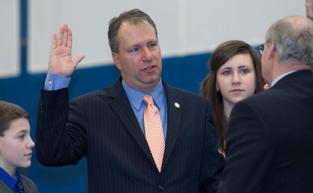 Orange County District Attorney David Hoovler takes the oath of office administered by the Honorable Judge Jeffrey Berry during the swearing-in ceremony at SUNY Orange Campus in Middletown on Wednesday, January 1, 2014.  