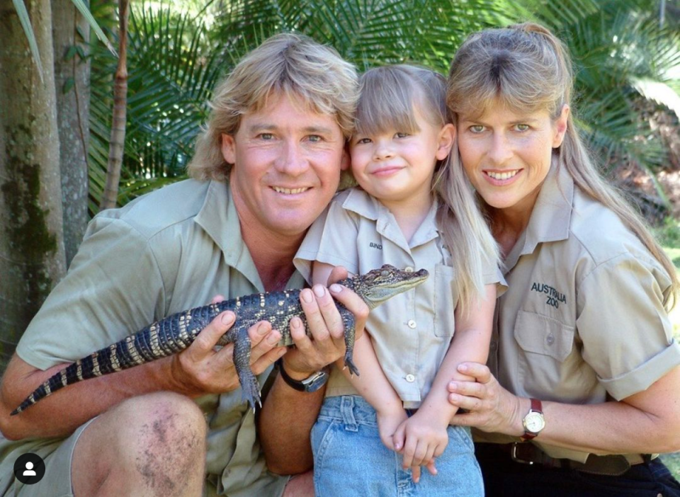 Steve, Bindi and Terri Irwin with a small crocodile.