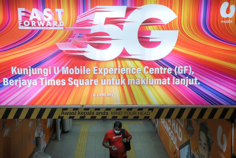 An advertisement of 5G network is displayed in Kuala Lumpur